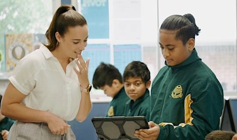 Student with teacher and tablet_s-1